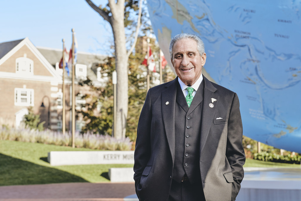 Arthur Blank in front of globe