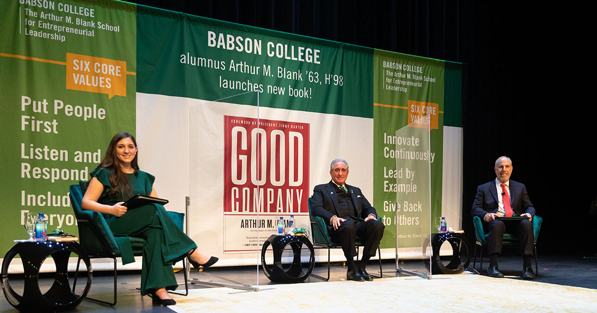 Andrea Lindner ’22, Arthur M. Blank ’63, H’98, and President Stephen Spinelli Jr. MBA ’92, PhD