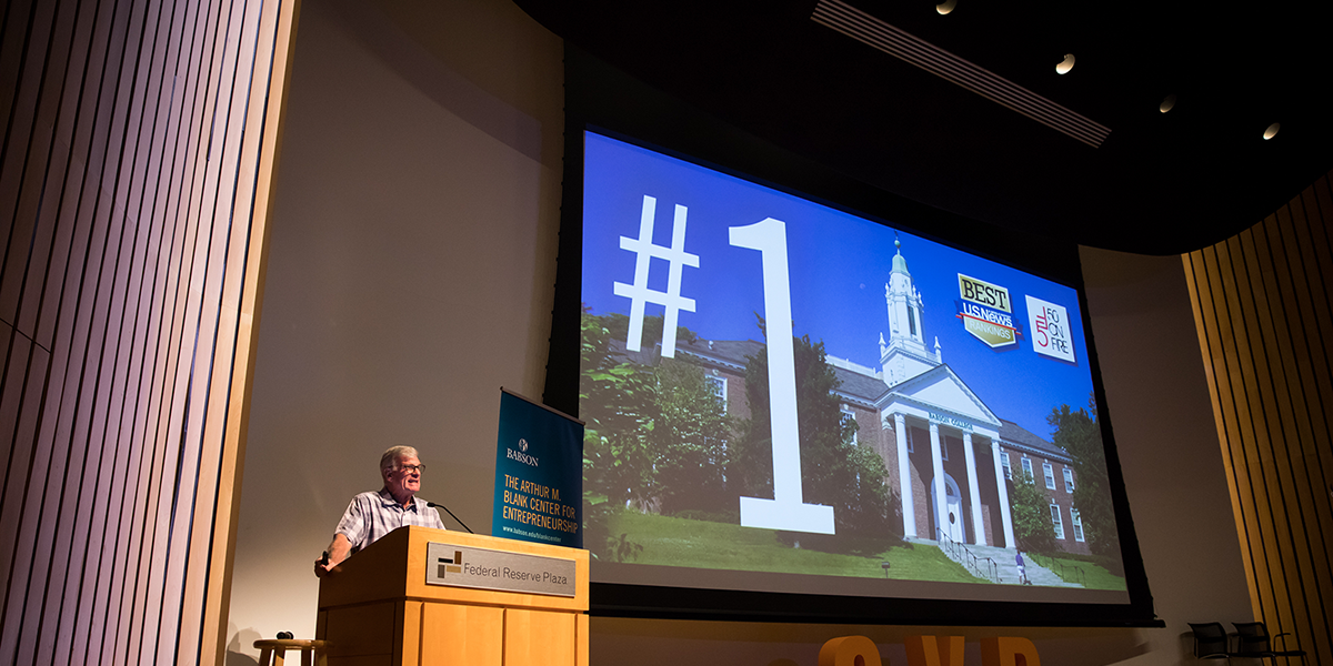 Man Standing at Podium