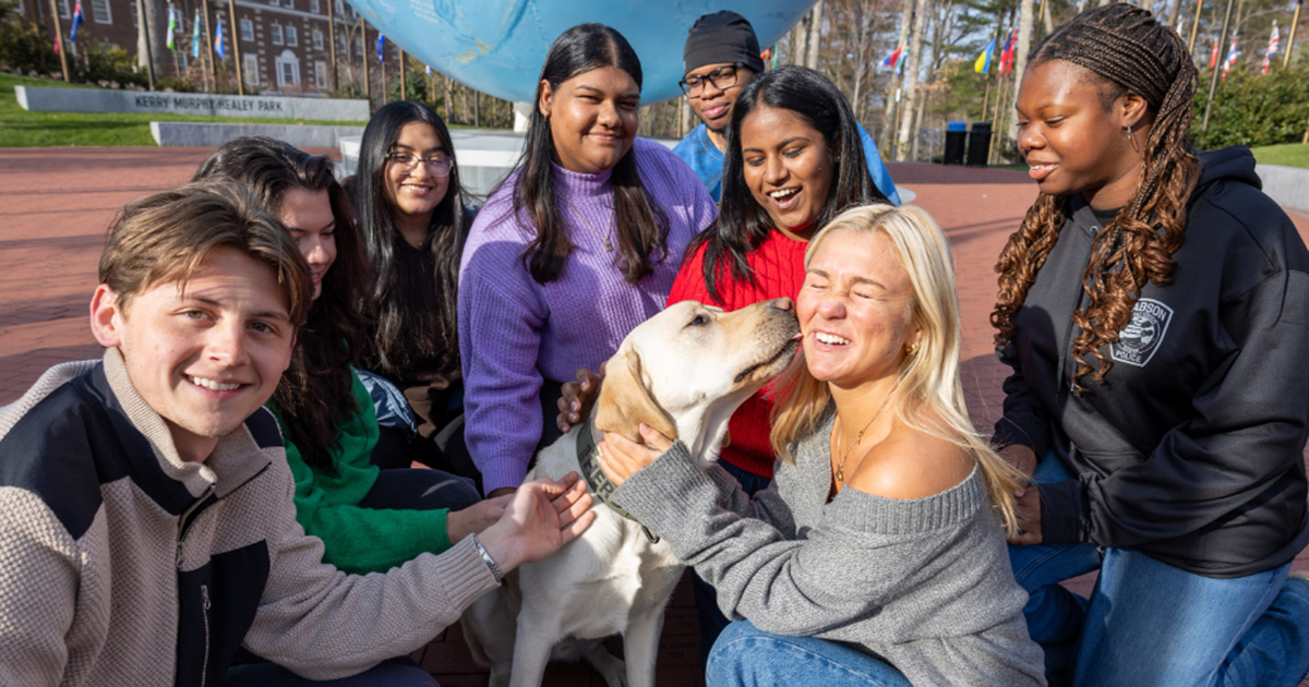 Students next to the globe with Hero the dog