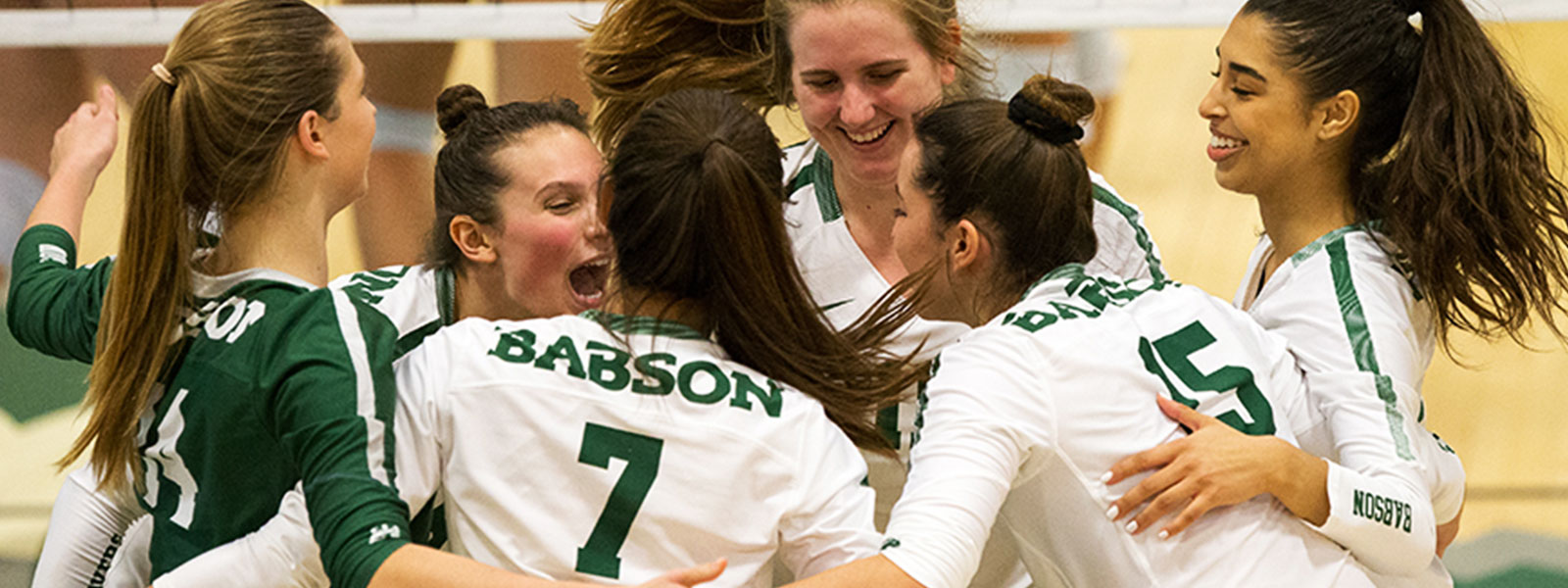 Image of Girls Volleyball team celebrating a win