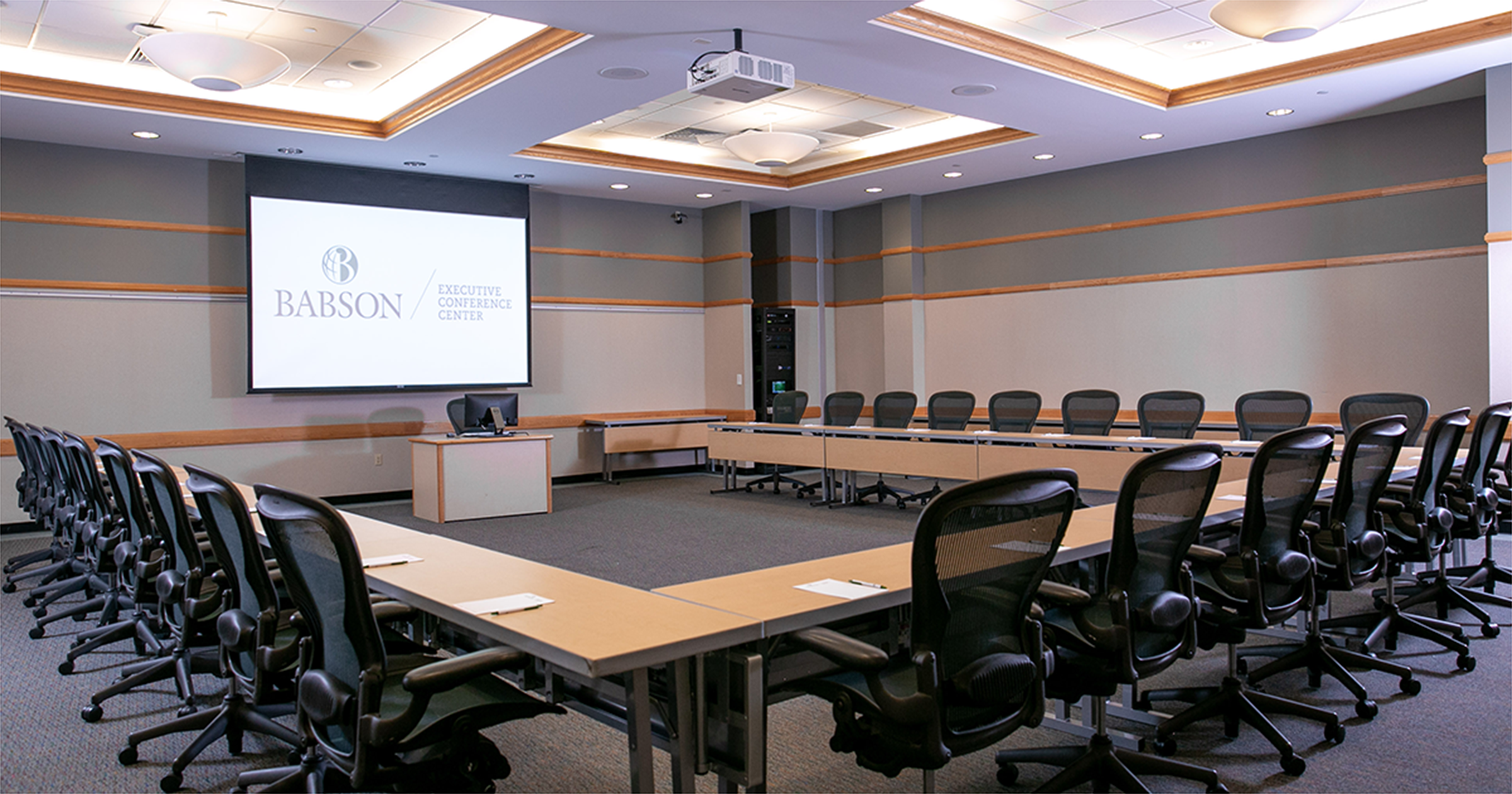 conference room setup in U shape with projector