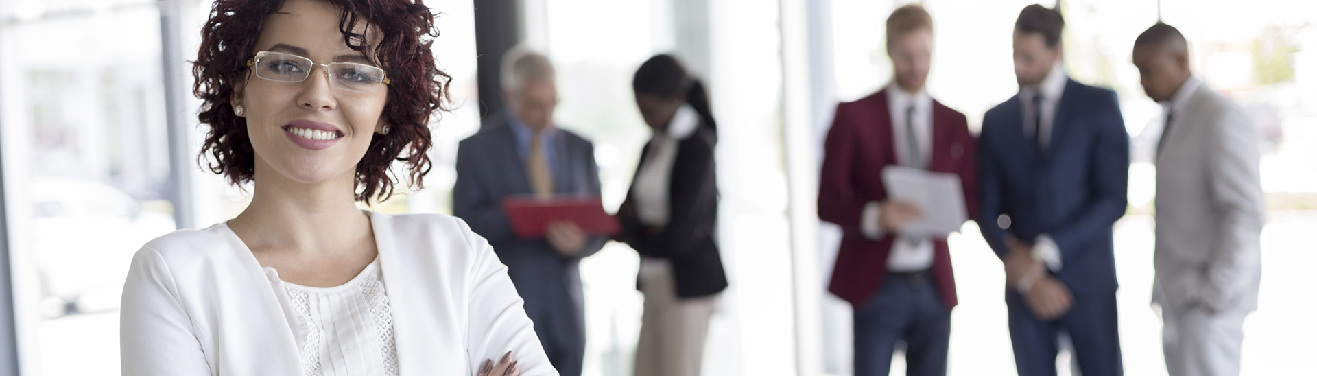 smiling professional with people consulting on the background