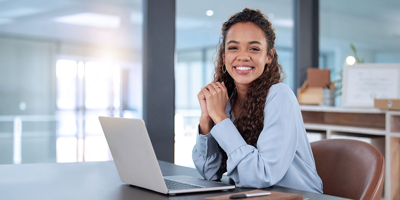 Person on a Desk with Laptop