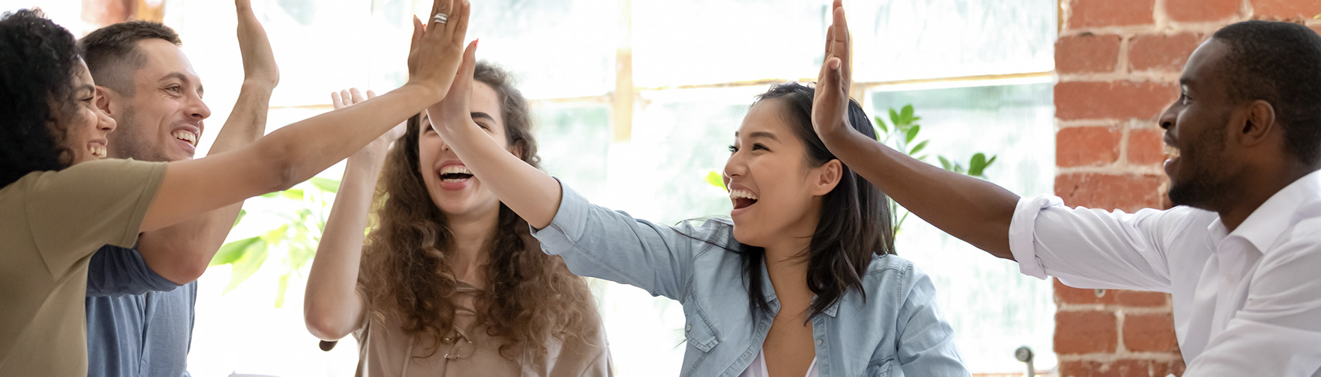 Happy people high-fiving