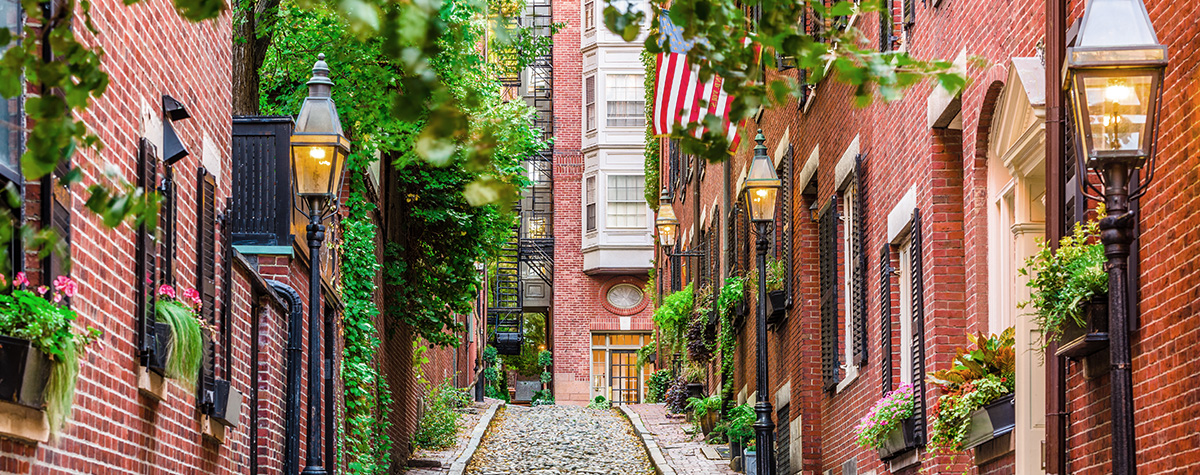 Small cobble stone street between brick buildings