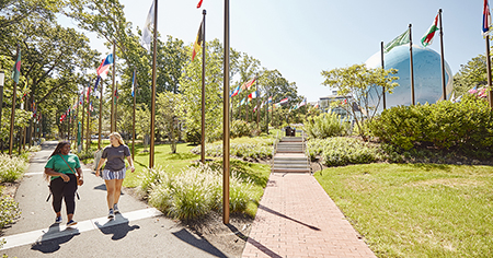 Students walk on campus in summer