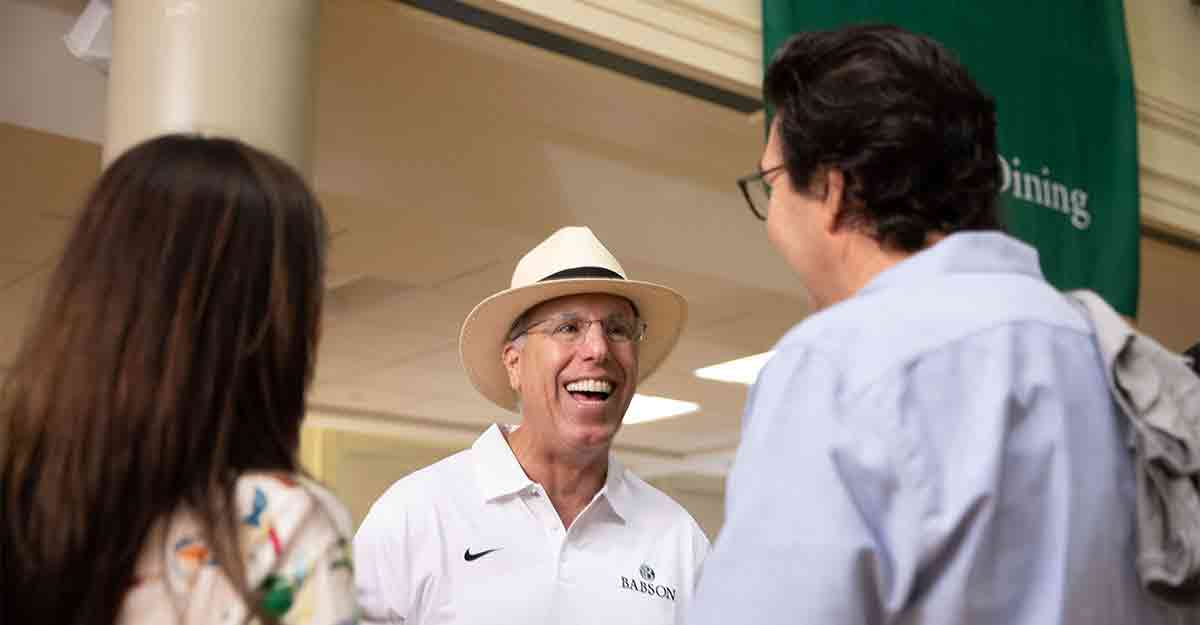 President Spinelli talking with students