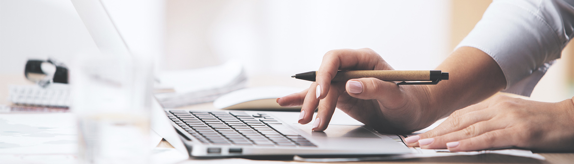 Hands on laptop keyboard