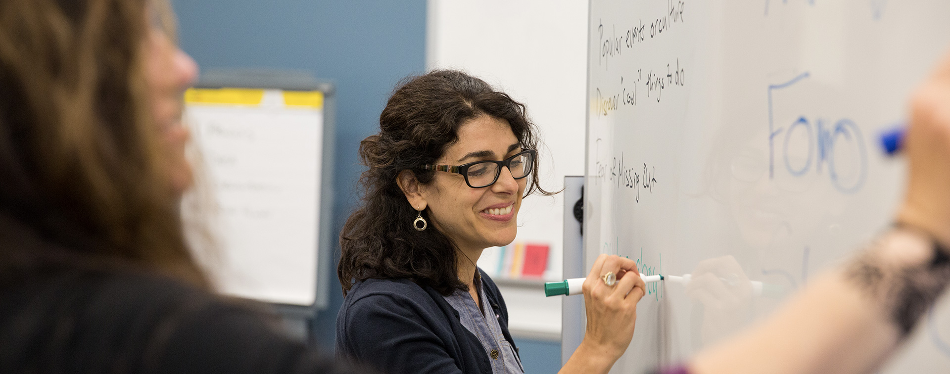 Person writing on a whiteboard