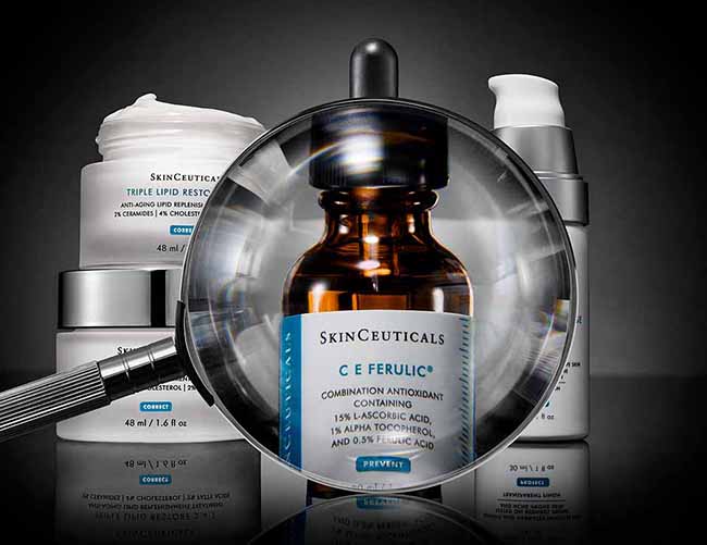 Magnifying glass placed in front of Skinceuticals C E Ferulic serum