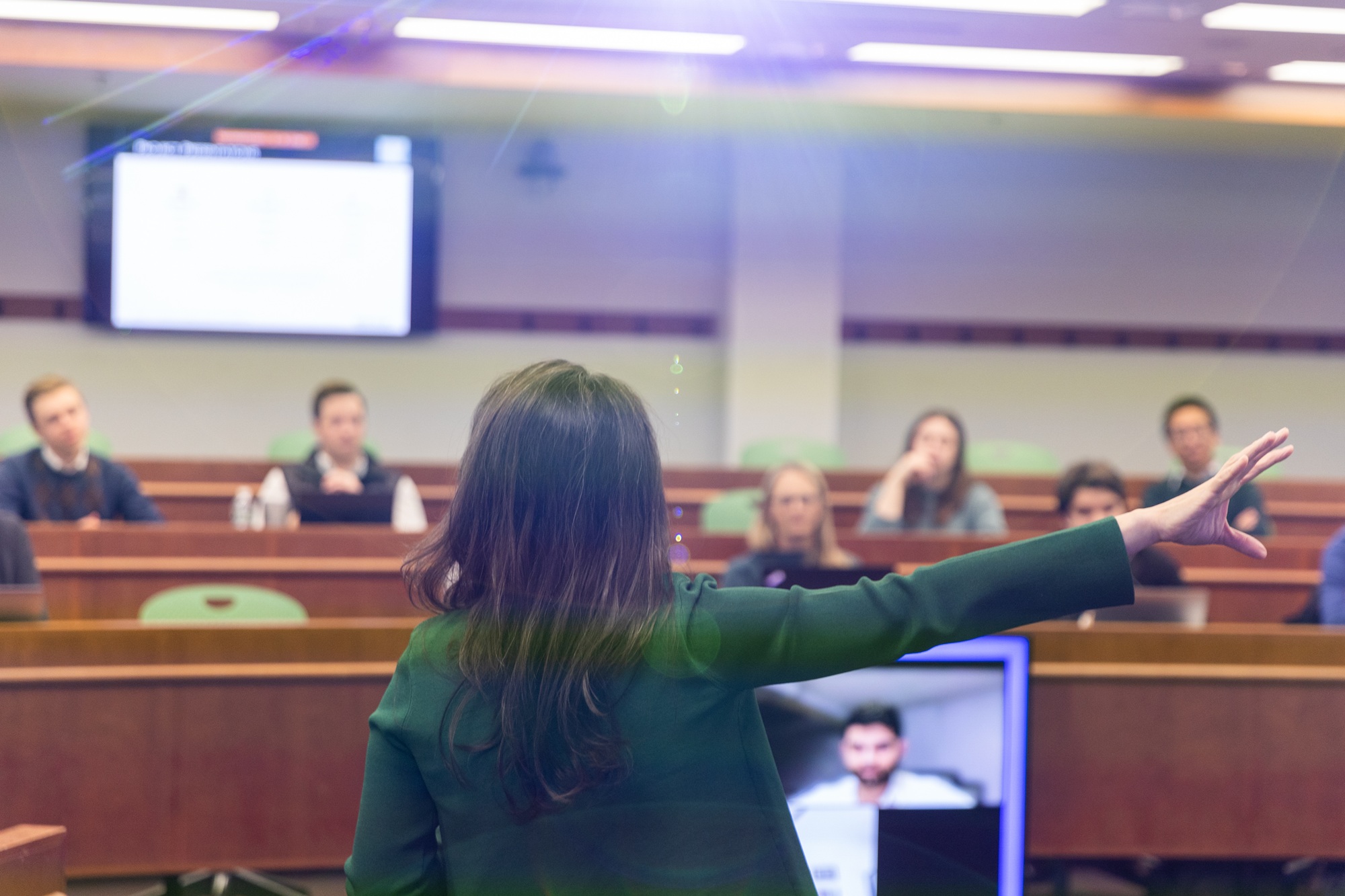 A professor teaching in front of a class