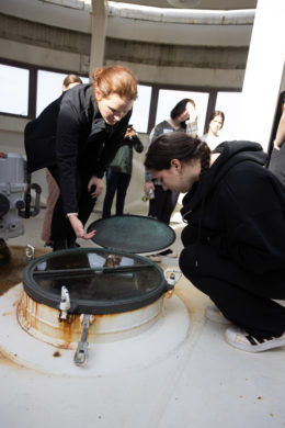 Two people looking at water systems equipment