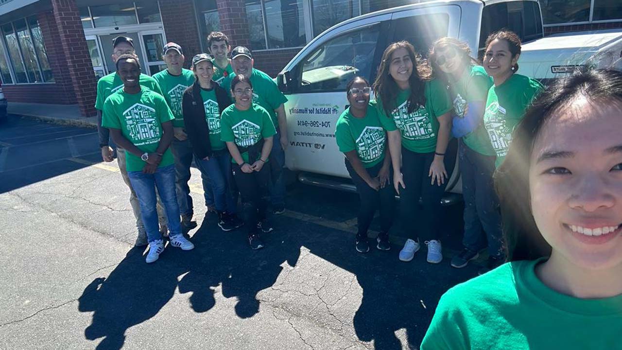 Group of students outside Habitat for Humanity building