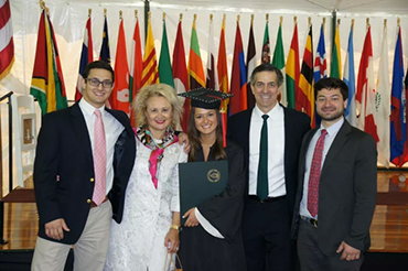 Family in front flags